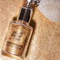 Spray de purpurina dorada